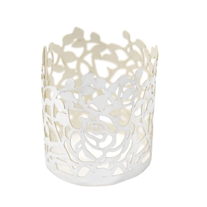 Macro detail of laser-cut rose floral pattern on pearl white paper napkin ring