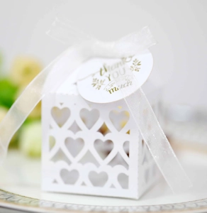 Detail of white hollow heart candy box with Thank You tag and elegant ribbon bow