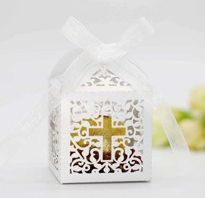 Laser-cut white wedding candy box with cross pattern and elegant white organza ribbon bow