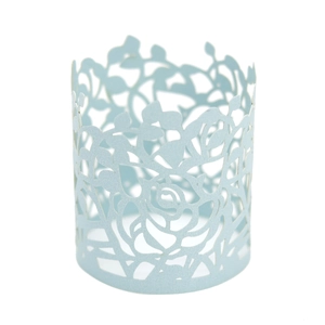 Macro detail of laser-cut light blue paper napkin ring with delicate rose flower pattern