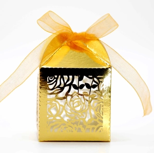 Gold hollow rose pattern gift box with orange ribbon for wedding favors and parties