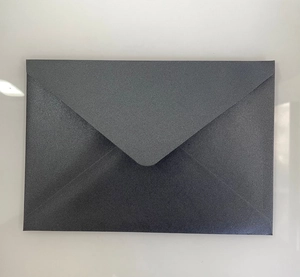 Detailed top view of a dark grey pearlescent paper envelope with V-flap and metallic finish