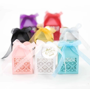 Detailed laser-cut floral candy boxes with organza ribbons and thank you tags