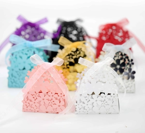 Laser cut floral candy gift boxes with organza ribbons in various vibrant colors