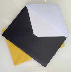 Elegant black and yellow 120g pearlescent paper envelopes shown at a 45-degree angle view