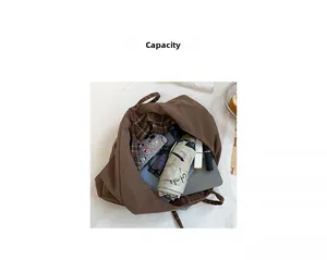 Detailed interior view of the large capacity tote bag showing laptop and daily essentials