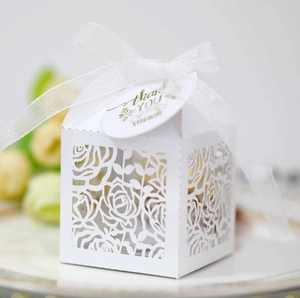 Detailed laser-cut rose hollow favor box with white ribbon and thank you tag