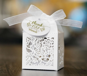 Elegant white laser-cut rose candy box with silk ribbon and thank you tag for weddings