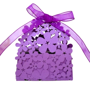 Purple laser-cut floral wedding favor box with matching ribbon on white background