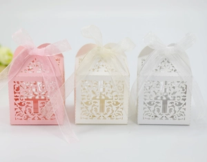 Detailed laser-cut wedding favors with cross design in pink, beige and white colors