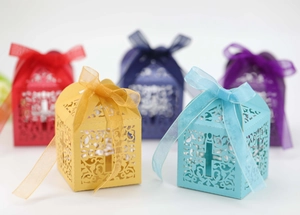 Detailed laser-cut gift boxes with cross pattern and elegant organza ribbons in five colors