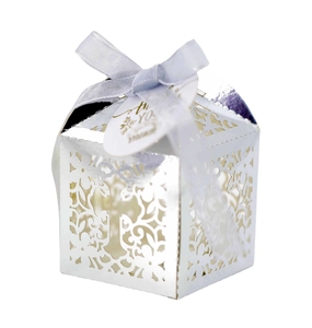 Elegant laser cut hollow gift box with light blue ribbon and thank you tag