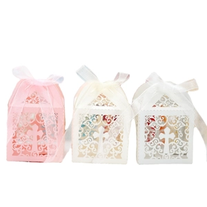 Laser cut cross candy boxes in pink, beige, and white colors for wedding favors