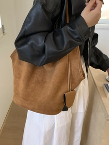Minimalist large capacity caramel brown suede tote bag for women shown as a stylish shoulder bag