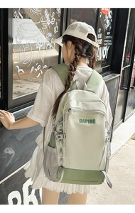 Outdoor green backpack with DAPING logo shown in a street lifestyle setting on model