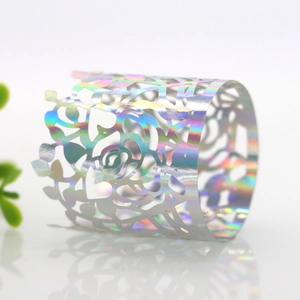 Macro view of laser-cut holographic rose napkin ring with iridescent reflective finish