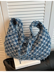 Retro denim tote bag featuring blue and white checkerboard pattern with frayed edges