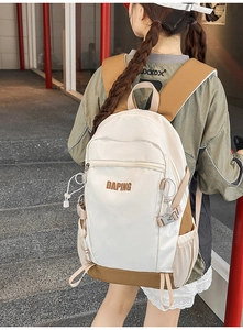Outdoor lifestyle view of the color-block backpack with wide straps and side pockets