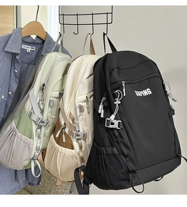 Detailed display of large capacity canvas backpacks in black, beige, and green colors