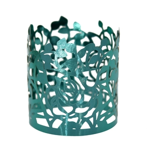 Detailed laser-cut turquoise napkin ring featuring an intricate floral rose pattern