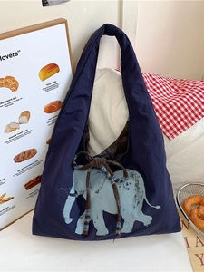 Large navy canvas tote bag featuring a light blue elephant print and plaid ribbon detail