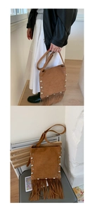 Close-up of brown suede crossbody bag featuring retro rivets and long bohemian tassels