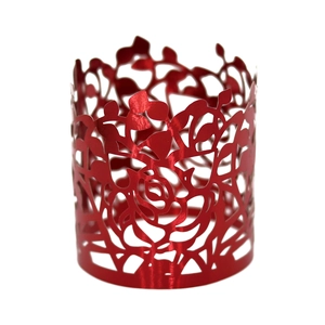 Detail of red hollowed-out rose pattern napkin ring with precise laser-cut texture
