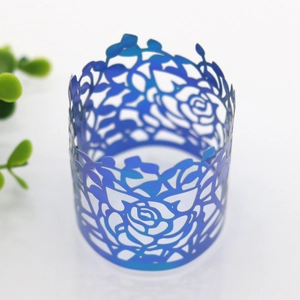 Detail of dark blue laser-cut rose floral napkin ring for wedding table decoration
