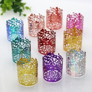 Laser-cut rose pattern napkin rings in various pearlescent colors for wedding decor