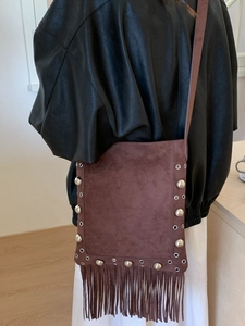 Brown suede bohemian crossbody bag with metallic silver studs and long fringe details