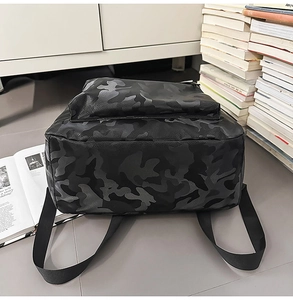 Close-up of the camouflage pattern and smooth water-resistant fabric of this stylish backpack