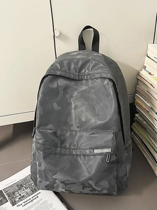 Grey camouflage backpack with front zipper pocket and Colorful Juvenile brand label