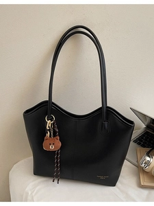 Large black leather tote bag with V-shaped opening and cute bear charm for women