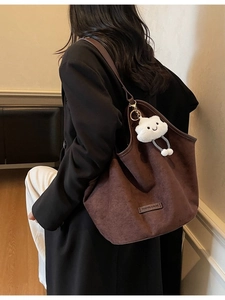Large vintage dark brown suede tote bag with plush cloud charm and fashion tag