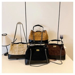 Detail of vintage quilted faux suede chain bags in white, black, brown and coffee colors