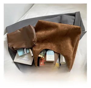 Large brown frosted suede tote bag showing internal capacity with tablet and daily essentials