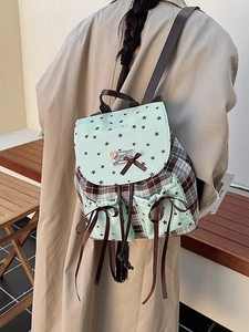 Plaid canvas backpack with mint green star print flap and brown ribbon bows for women