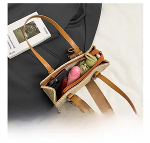 Top view of woven straw tote bag showing spacious interior with phone and daily items