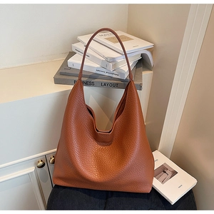 Close-up of retro brown hobo bag showing high-quality lychee texture leather detail