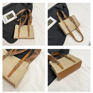 Detail view of khaki straw tote bag with brown leather trim and wide fabric strap