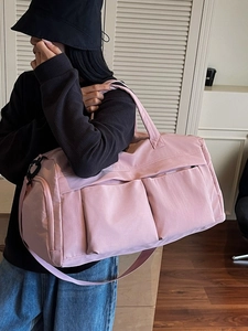 Pink large capacity travel duffel bag with shoulder strap for sports and gym carry