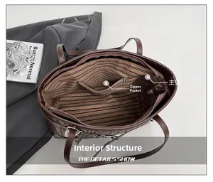 Detail view of large brown woven tote bag showing striped interior lining and zipper pocket