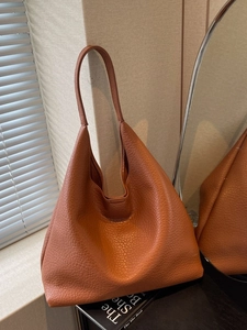 Caramel pebble leather tote bag with a minimalist large capacity shoulder strap design