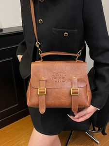 Retro brown leather satchel with dual gold buckles and adjustable strap for women