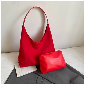 Detail view of red vintage frosted tote bag set with matching zipper clutch pouch