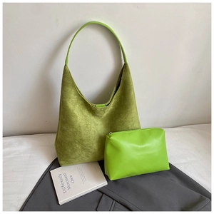 Close-up of matte green suede tote bag and matching smooth PU leather zipper pouch set