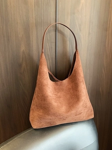 Minimalist brown suede tote bag with slim shoulder strap for casual commute