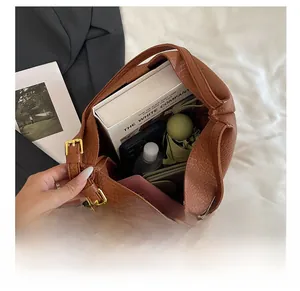 Internal storage view of brown ostrich texture tote bag showing spacious capacity for items