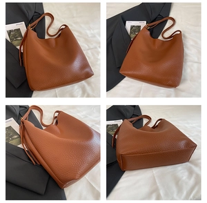 Detailed views of brown lychee leather hobo bag showing large capacity and soft texture