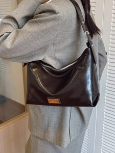 Glossy chocolate brown hobo underarm bag with silver hardware for women